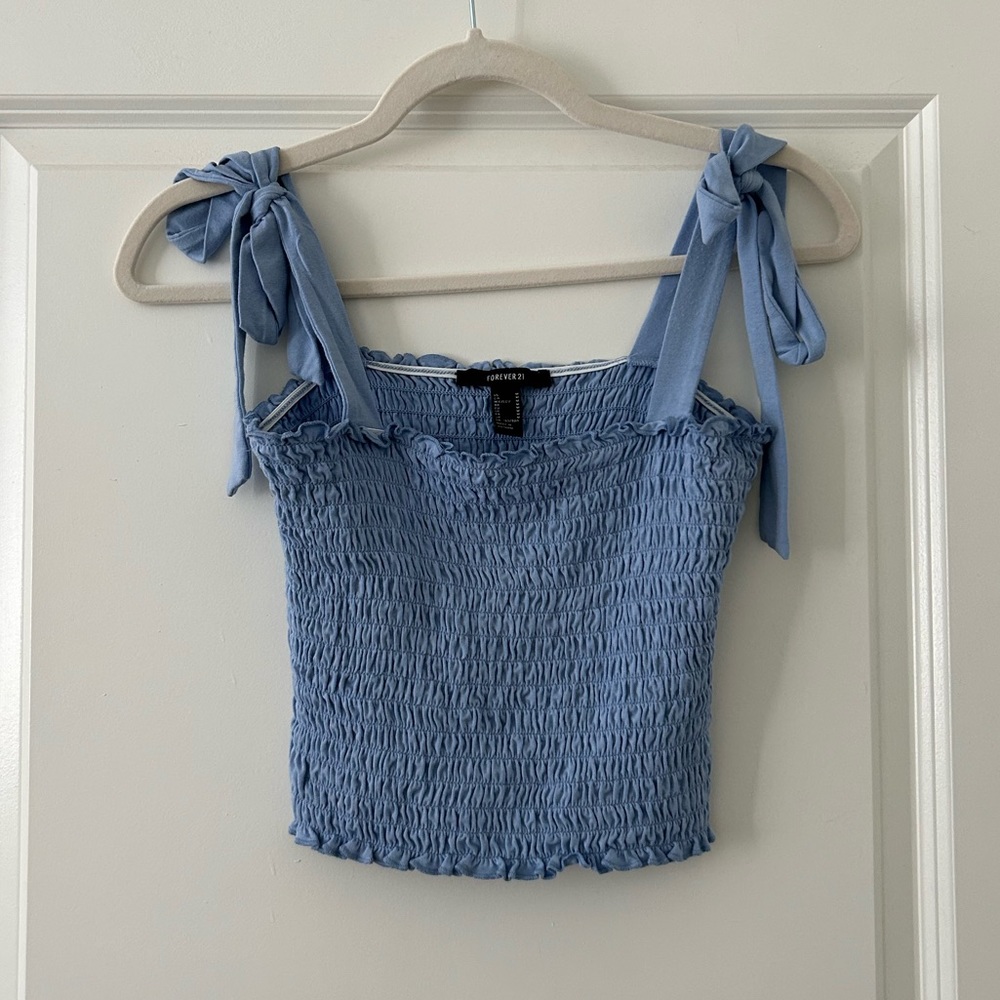 blue top with bows